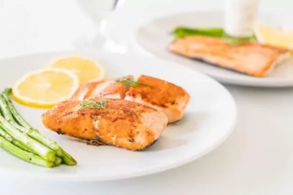 Plates of salmon fish containing high omega 3 fatty acids