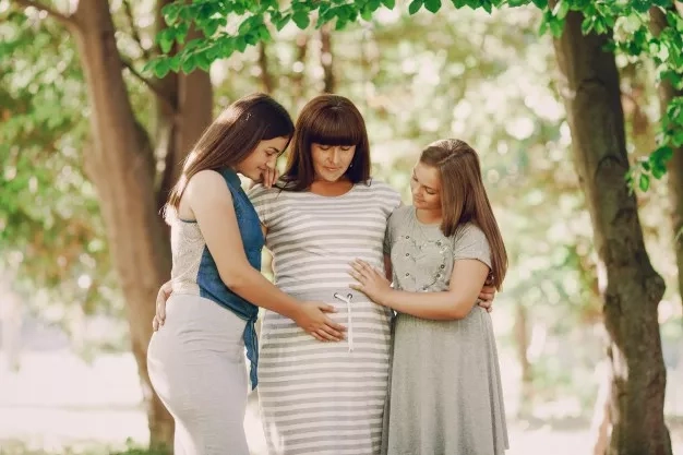pregnant woman with her family members
