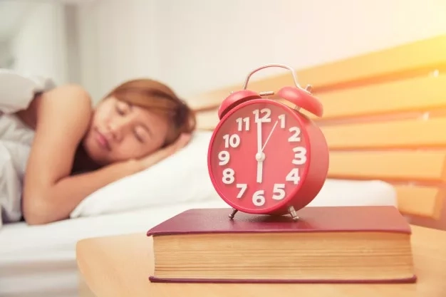 girl sleeping on her bed