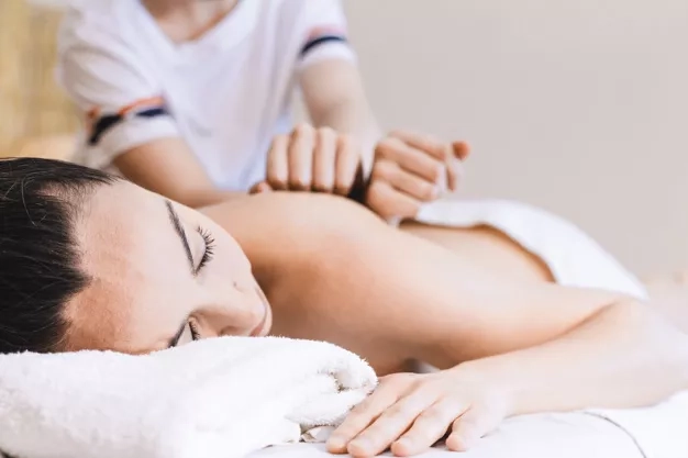 Woman enjoying her massage session.
