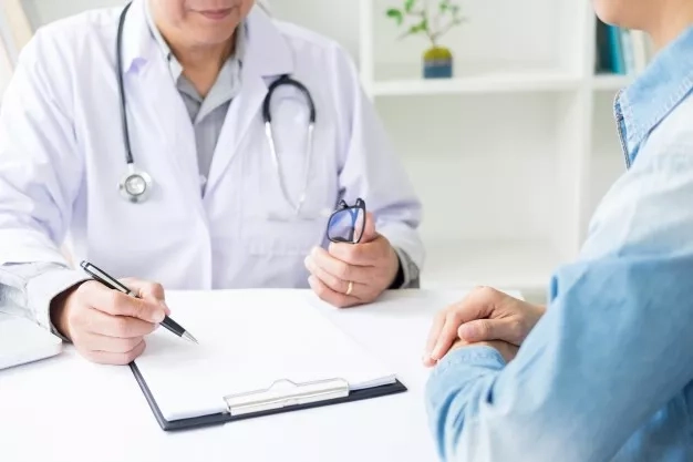 patient consulting doctor at the clinic